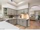 Modern kitchen with gray cabinets, sleek countertops, and an open layout, perfect for cooking and entertaining at 7955 E Chaparral Rd # 115, Scottsdale, AZ 85250