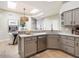 Bright kitchen with modern appliances, countertops, and stylish lighting at 7955 E Chaparral Rd # 115, Scottsdale, AZ 85250