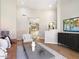Open-concept living room with modern decor and entertainment setup at 7955 E Chaparral Rd # 115, Scottsdale, AZ 85250