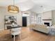 Stylish living space features a dining area, modern lighting, and a cozy fireplace, enhanced by natural light at 7955 E Chaparral Rd # 115, Scottsdale, AZ 85250