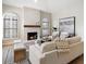 Inviting living area with a fireplace and large windows, offering a comfortable space with modern decor at 7955 E Chaparral Rd # 115, Scottsdale, AZ 85250