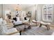 Bright living room with neutral tones, stylish furniture, and modern decor with light coming in from window shutters at 7955 E Chaparral Rd # 115, Scottsdale, AZ 85250