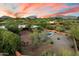Aerial view showcases pool, firepit, and mature landscaping at 8035 E Paraiso Dr, Scottsdale, AZ 85255
