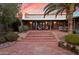 Expansive brick patio with covered seating area, perfect for outdoor dining and relaxation at 8035 E Paraiso Dr, Scottsdale, AZ 85255