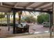 View of outdoor patio, pool and lush backyard from the kitchen window at 8035 E Paraiso Dr, Scottsdale, AZ 85255