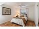 Cozy bedroom with ceiling fan, painted brick wall, and tile floor at 8035 E Paraiso Dr, Scottsdale, AZ 85255