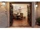 Elegant dining room with a chandelier, tile floors, and exposed brick accents at 8035 E Paraiso Dr, Scottsdale, AZ 85255