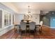 Dining room featuring brick-style tile flooring, chandelier, and large window at 8035 E Paraiso Dr, Scottsdale, AZ 85255