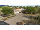 Charming single-story home with desert landscaping, a brick exterior, and a two-car garage at 8035 E Paraiso Dr, Scottsdale, AZ 85255