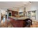 Open kitchen featuring granite countertops, stainless steel appliances, and a large island at 8035 E Paraiso Dr, Scottsdale, AZ 85255