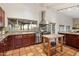 Gourmet kitchen featuring stainless steel appliances, granite countertops, and an island at 8035 E Paraiso Dr, Scottsdale, AZ 85255
