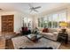 Bright living room with white brick walls, shutters, and stylish decor at 8035 E Paraiso Dr, Scottsdale, AZ 85255