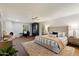 Bright main bedroom featuring a cozy fireplace, white brick walls and hardwood flooring at 8035 E Paraiso Dr, Scottsdale, AZ 85255