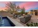 Scenic patio with lounge seating, desert views, and a decorative water feature at 8035 E Paraiso Dr, Scottsdale, AZ 85255