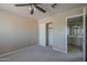 Bedroom featuring carpeted floors, access to bathroom, and closet at 823 W Bradford Dr, Gilbert, AZ 85233