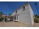 Exterior elevation of the home with a covered patio at 823 W Bradford Dr, Gilbert, AZ 85233