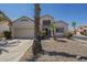 Charming single-Gathering home with desert landscaping, two car garage and decorative architectural features at 823 W Bradford Dr, Gilbert, AZ 85233