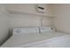 Washer and dryer with overhead storage space at 823 W Bradford Dr, Gilbert, AZ 85233