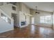 Spacious living room with fireplace, staircase, and large windows for natural light and stained concrete floor at 823 W Bradford Dr, Gilbert, AZ 85233
