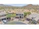 Beautiful home with a desert landscape, pool, and mountain views in a modern community at 9017 E June Cir, Mesa, AZ 85207