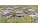 Aerial shot shows a home with a spacious backyard, covered patio and community view at 9017 E June Cir, Mesa, AZ 85207