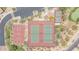 Aerial view of multiple tennis and basketball courts with parking lot and desert landscaping surrounding the area at 9017 E June Cir, Mesa, AZ 85207