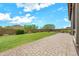 Well maintained backyard has lush lawn, hardscape and is surrounded by block wall with colorful plants at 9017 E June Cir, Mesa, AZ 85207