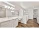 Bright bathroom with dual sinks, a make-up vanity, and glass enclosed shower at 9017 E June Cir, Mesa, AZ 85207