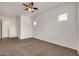 Spacious bedroom with neutral walls, carpet and a ceiling fan at 9017 E June Cir, Mesa, AZ 85207