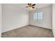 Light filled bedroom, complete with carpet, ceiling fan and large picture window at 9017 E June Cir, Mesa, AZ 85207