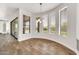 Bright dining room featuring tile floors and sunny bay windows at 9017 E June Cir, Mesa, AZ 85207