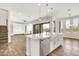 Spacious kitchen island with stainless steel dishwasher and view of the living space and backyard at 9017 E June Cir, Mesa, AZ 85207