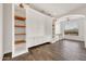 Bright room featuring custom built-ins, shelving and wooden floors at 9017 E June Cir, Mesa, AZ 85207
