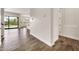 Spacious living room with view to backyard, kitchen, and front door at 9017 E June Cir, Mesa, AZ 85207
