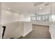 Open loft area with carpet, recessed lighting, and large windows with mountain views at 9017 E June Cir, Mesa, AZ 85207