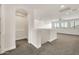 Spacious upstairs loft area with carpet, open views, and modern recessed lighting at 9017 E June Cir, Mesa, AZ 85207