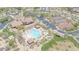Aerial view of a resort-style recreation center featuring a pool, clubhouse, and tennis courts at 9017 E June Cir, Mesa, AZ 85207
