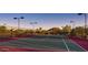Scenic outdoor tennis court, perfect for enjoying a match with friends or honing your skills in a picturesque setting at 9017 E June Cir, Mesa, AZ 85207