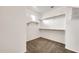 Walk-in closet with adjustable shelving and ample storage space at 9017 E June Cir, Mesa, AZ 85207