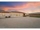 A large backyard with gravel, and a covered patio area, perfect for outdoor entertaining and relaxation at 9445 W Monte Lindo --, Peoria, AZ 85383