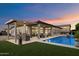 Inviting backyard oasis with a sparkling pool, covered patio, and outdoor bar area at 9445 W Monte Lindo --, Peoria, AZ 85383