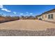Spacious backyard with gravel, and ample room for outdoor activities and potential landscaping projects at 9445 W Monte Lindo --, Peoria, AZ 85383