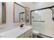 Bathroom featuring large shower with glass door, double sinks, and decorative mirror at 9445 W Monte Lindo --, Peoria, AZ 85383