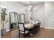 Formal dining room features a modern chandelier, large mirrors, and seating for eight guests at 9445 W Monte Lindo --, Peoria, AZ 85383