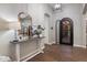 Foyer featuring a decorative table, mirror, and an ornate iron front door at 9445 W Monte Lindo --, Peoria, AZ 85383