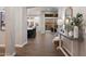 Hallway view with hardwood flooring and an open floor plan leading to the kitchen and backyard at 9445 W Monte Lindo --, Peoria, AZ 85383