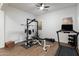 Bright home gym with weightlifting equipment, treadmill, and wood-look flooring at 9445 W Monte Lindo --, Peoria, AZ 85383