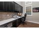 Well-lit home office featuring custom cabinetry, modern finishes, and a dedicated workspace at 9445 W Monte Lindo --, Peoria, AZ 85383