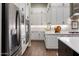 Bright kitchen with stainless steel appliances, quartz countertops, and plentiful storage at 9445 W Monte Lindo --, Peoria, AZ 85383