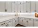 Pantry view showing white cabinetry, quartz countertops, and plenty of room for storage at 9445 W Monte Lindo --, Peoria, AZ 85383